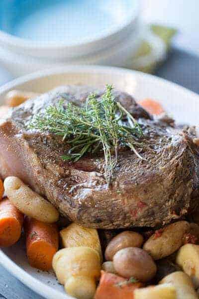 This slow cooker pot roast is going to knock your socks off! Tender beef and simple vegetables are cooked low and slow and are ready when you are! lemonsforlulu.com