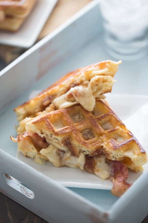 A savory waffle sandwich recipe with apple butter, bacon and fontina cheese! lemonsforlulu.com