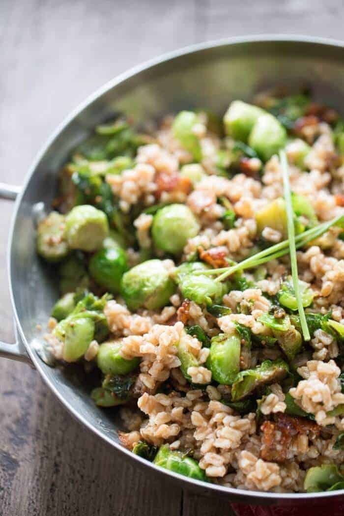 A perfect recipe for Brussels sprouts! This side has Brussels sprouts, bacon, farro and a honey mustard dressing! lemonsforlulu.com