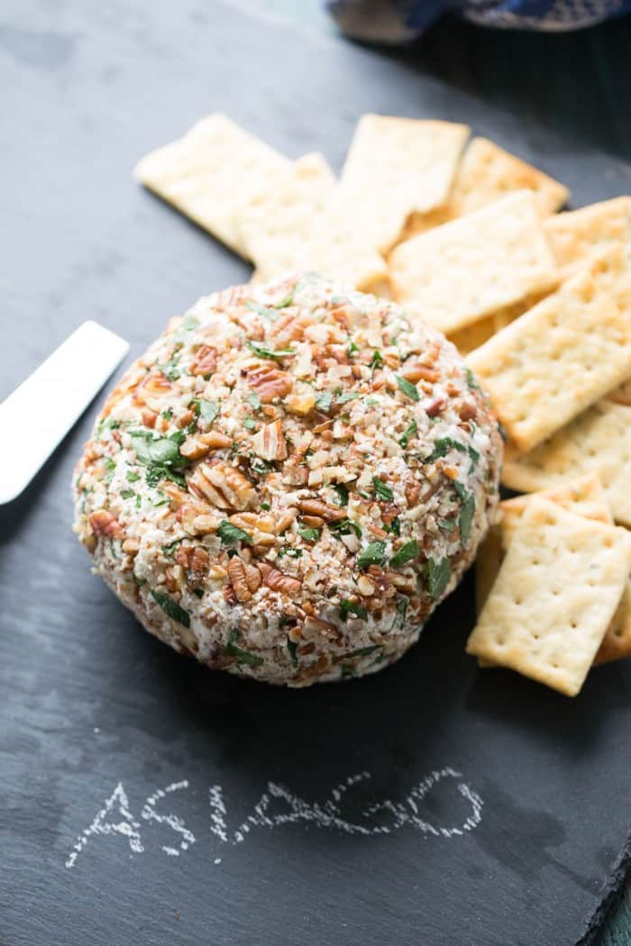 This cheese ball recipe is fabulous! Roasted garlic and Asiago cheese come together in perfect harmony. This appetizer is creamy, nutty, creamy and oh so cheesy! lemonsforlulu.com