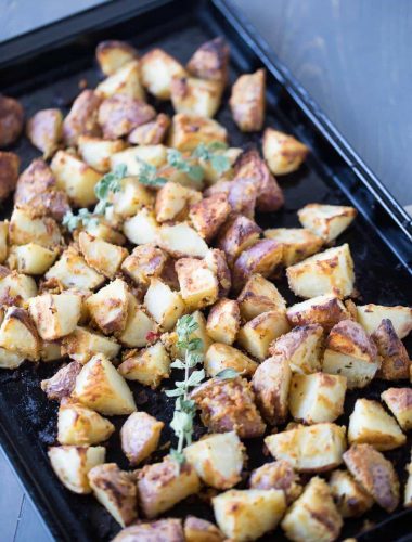 Oven-roasted-potatoes-that-are-simply-tossed-with-garlic-hummus. lemonsforlulu.com