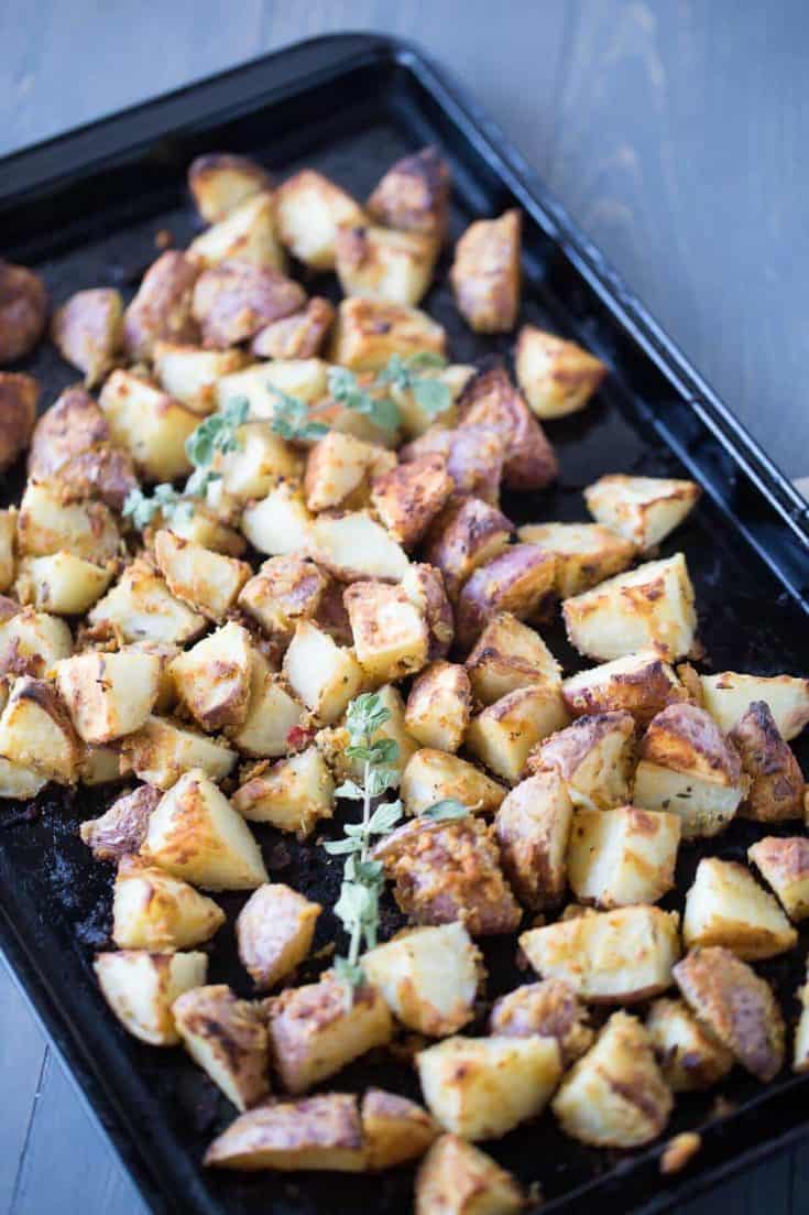Oven-roasted-potatoes-that-are-simply-tossed-with-garlic-hummus. lemonsforlulu.com