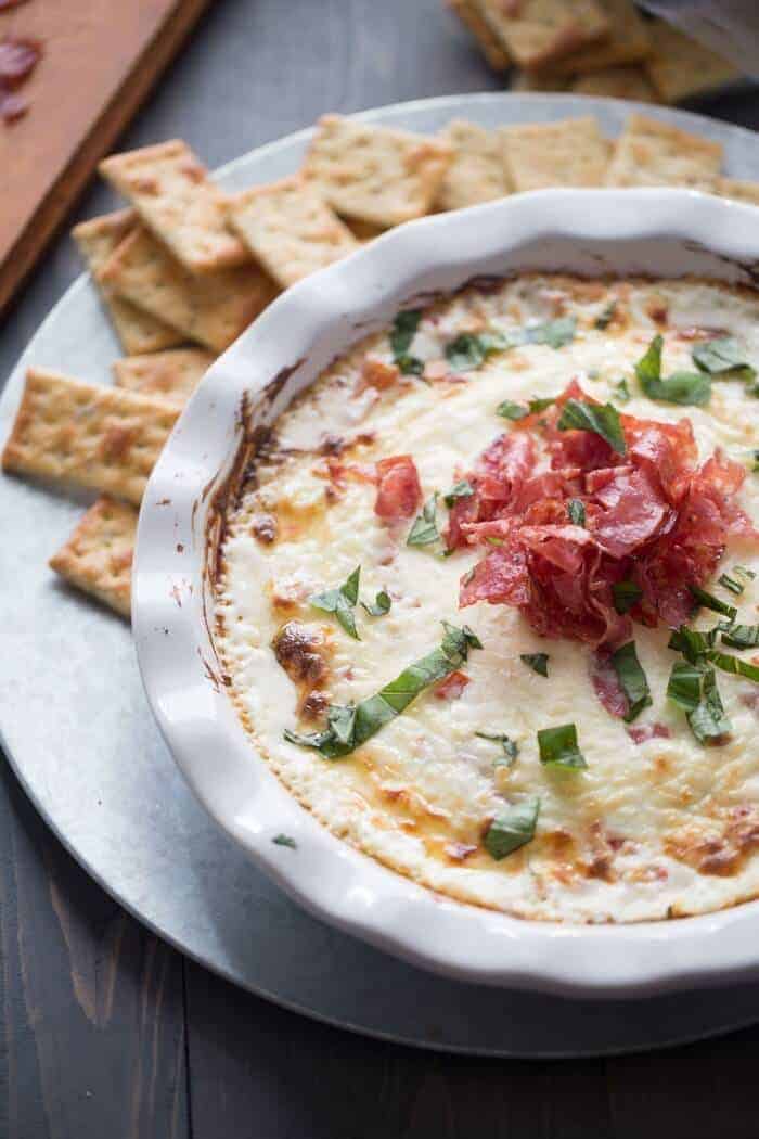 A new kind of bruschetta dip! This dip is full of hot melted cheese but tomatoes add a fresh spin while peppery soppressata add a unique to taste! lemonsforlulu.com