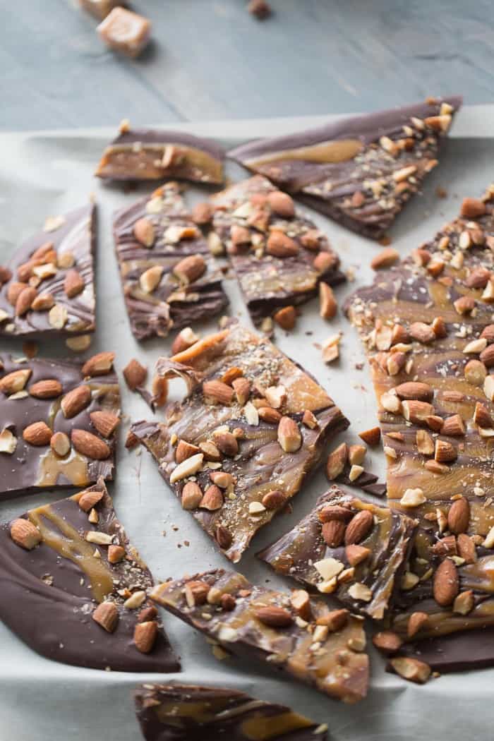 Dark chocolate bark recipe with sweet swirls of caramel and lightly salted almonds! lemonsforlulu.com