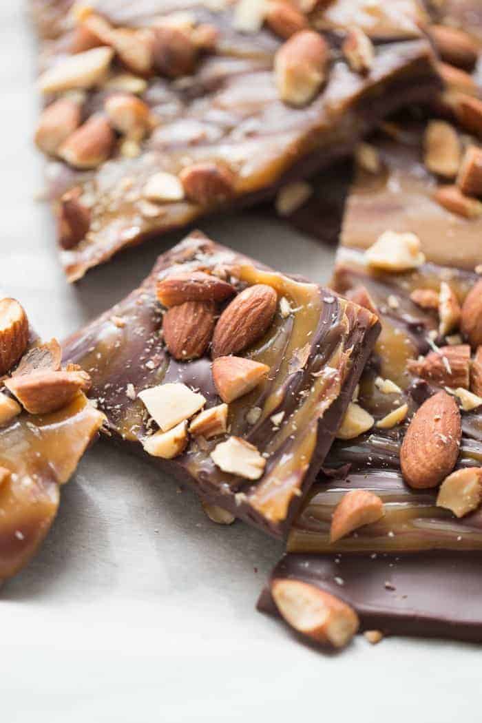 Dark chocolate bark recipe with sweet swirls of caramel and lightly salted almonds! lemonsforlulu.com