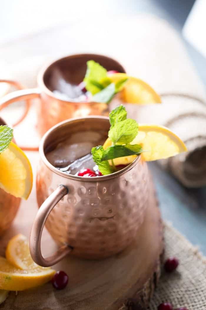 This is not your typical Moscow Mule drink recipe! Cranberry juice and a hint of citrus make this cocktial a seasonal favorite! lemonsforlulu.com