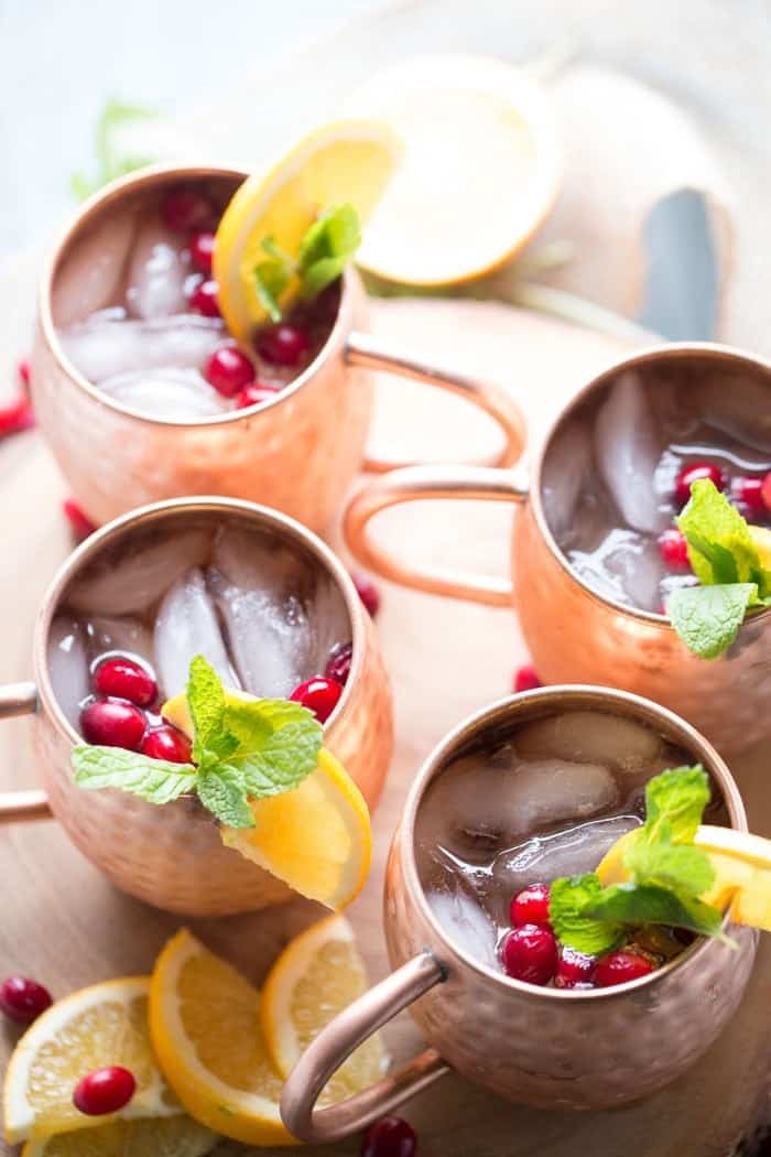 And easy Moscow Mule recipe with cranberry juice, ginger beer and a hint of citrus! lemonsforlulu.com