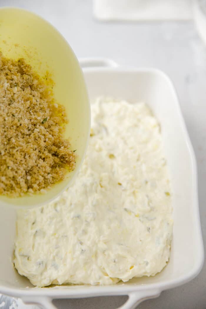 bread crumbs poured over pickle dip