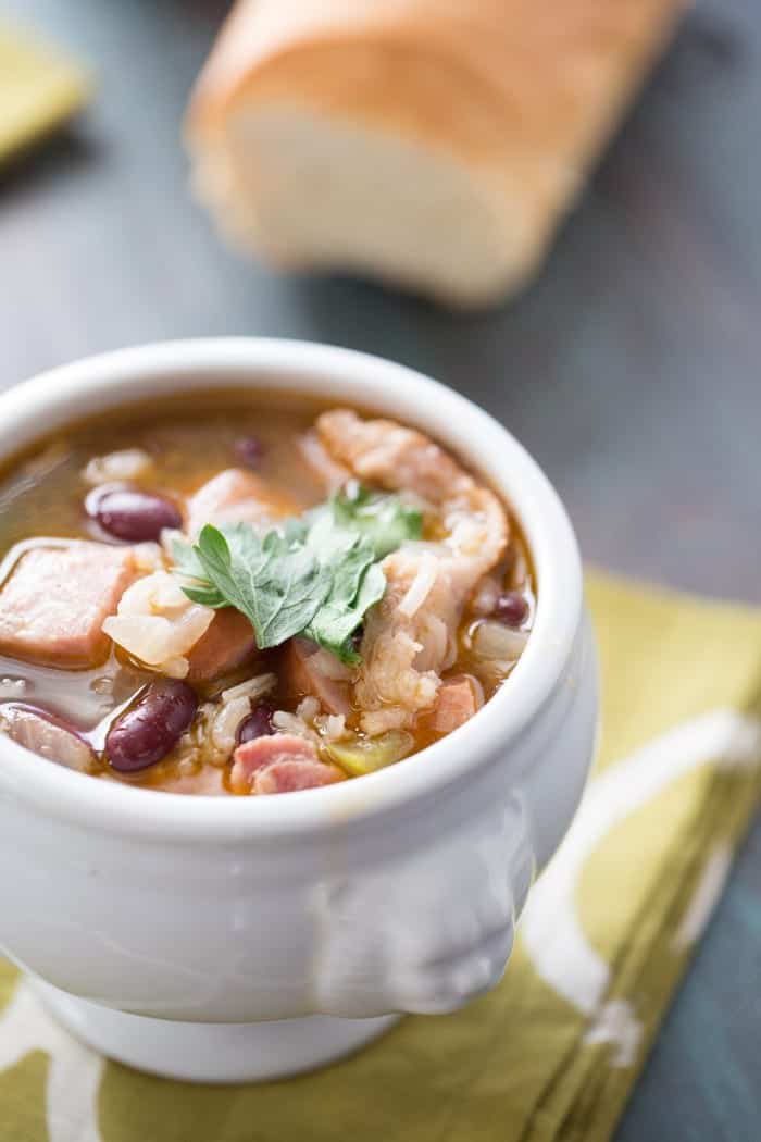 Red beans and rice soup will warm you up! This soup recipe is filling, flavorful and so easy! lemonsforlulu.com