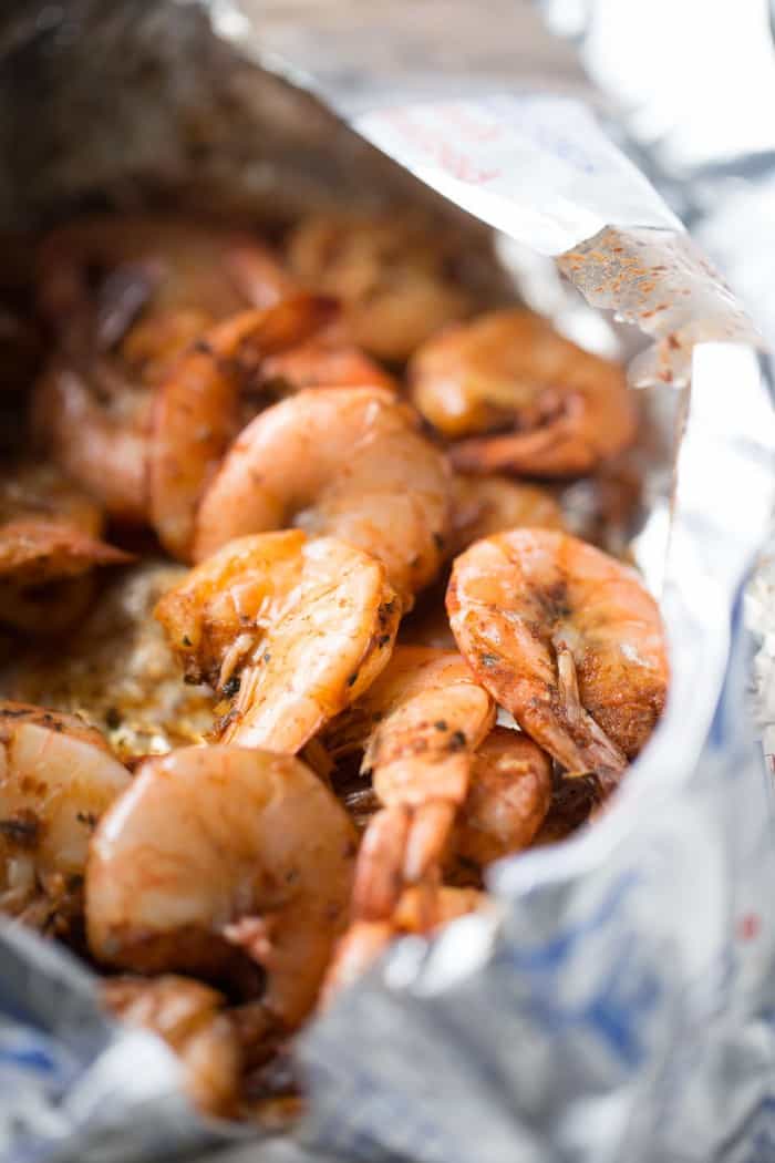 Cajun shrimp recipe over a simple mix of beans, sausage and quinoa! lemonsforlulu.com
