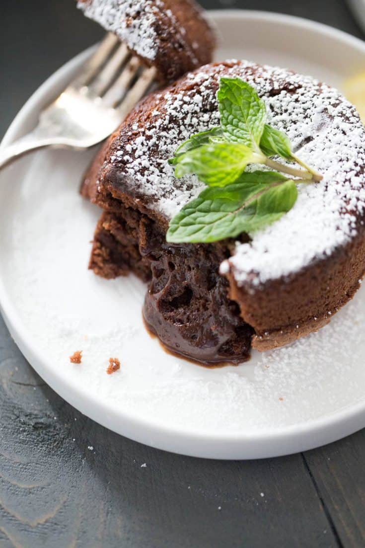 Limoncello chocolate lava cake is a rich and fudgy dessert, perfectly baked into individual portion sizes! You'll love these Limoncello infused chocolate lava cakes!