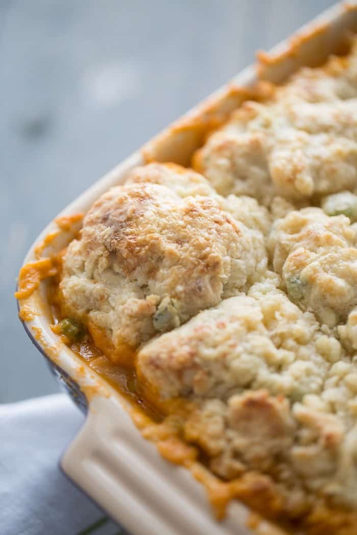 Creamy buffalo chicken cobber recipe is topped with savory blue cheese biscuits! This casserole is abosolute comfort food!