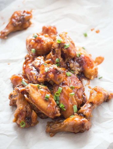 This oven baked chicken wings recipe is over the top delicious! Crispy baked wing are coated in a sticky stout and fig jam sauce!