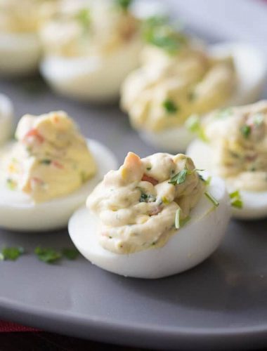 A simple deviled egg recipe with ranch seasoning and fresh garden veggies!