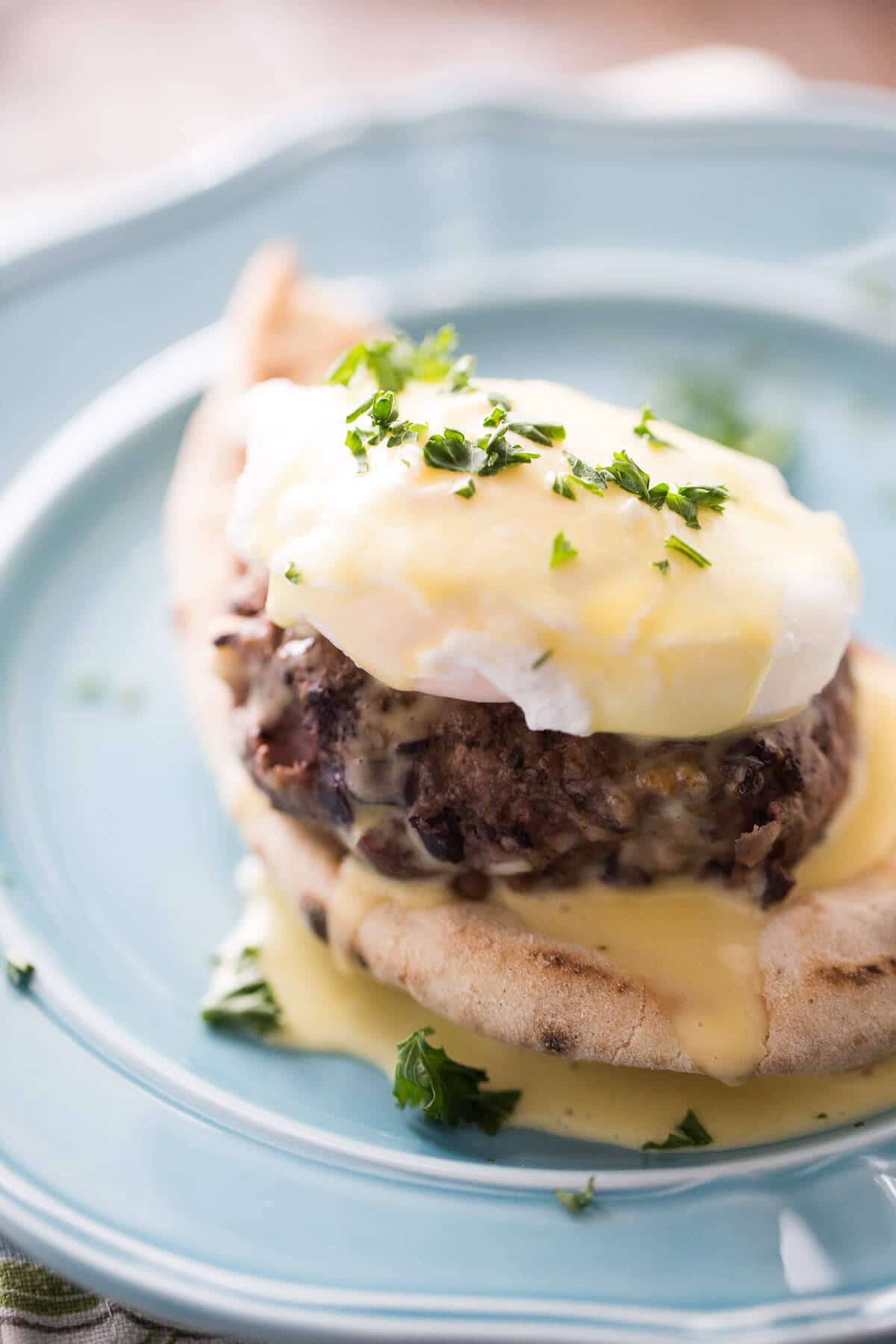 Greek flavored egg benedict with a simple blender hollandaise sauce!