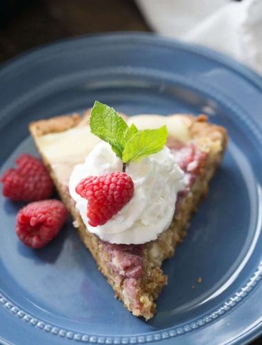 The raspberry amaretto cheesecake topping to this easy skillet blondie is like a dessert all on it's own!
