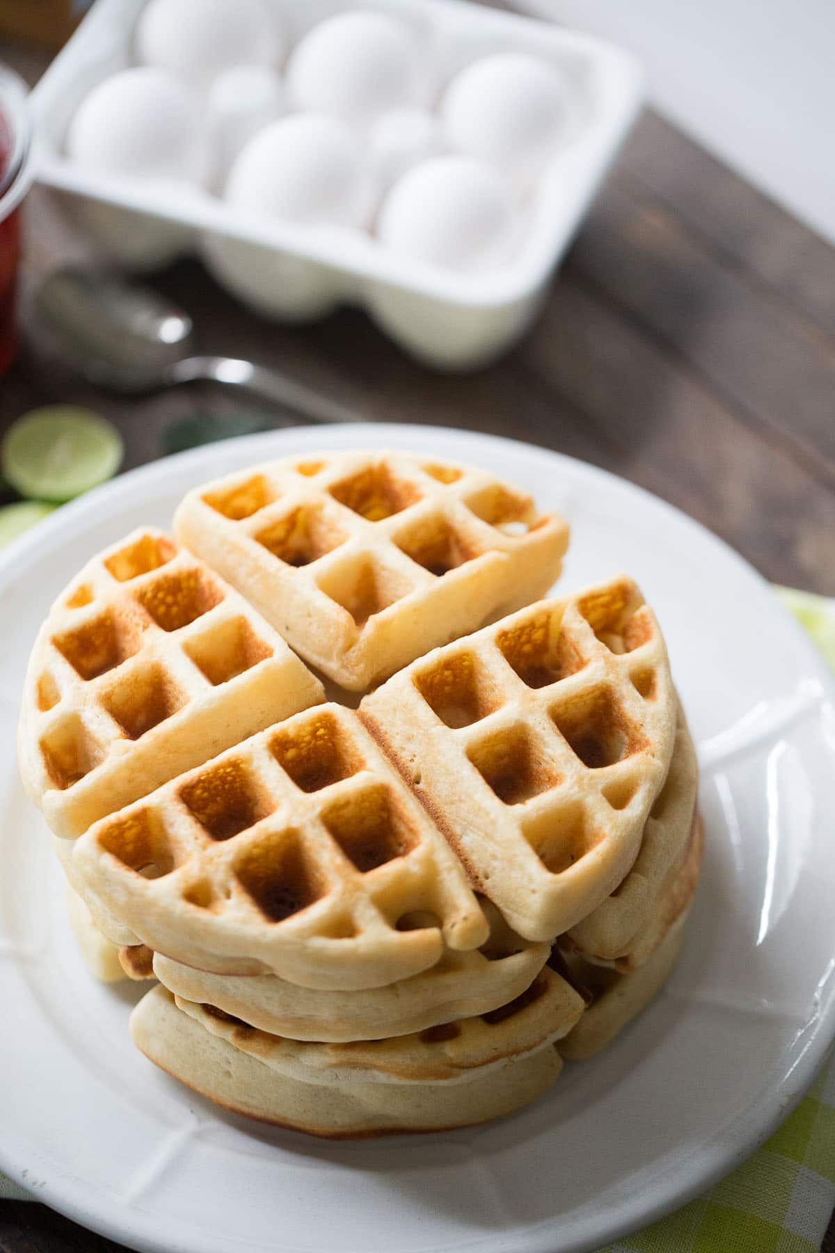 Homemade Belgian waffle recipe that is perfect for summer; fresh key lime flavor and sweet strawberries make this breakfast unbelievable!