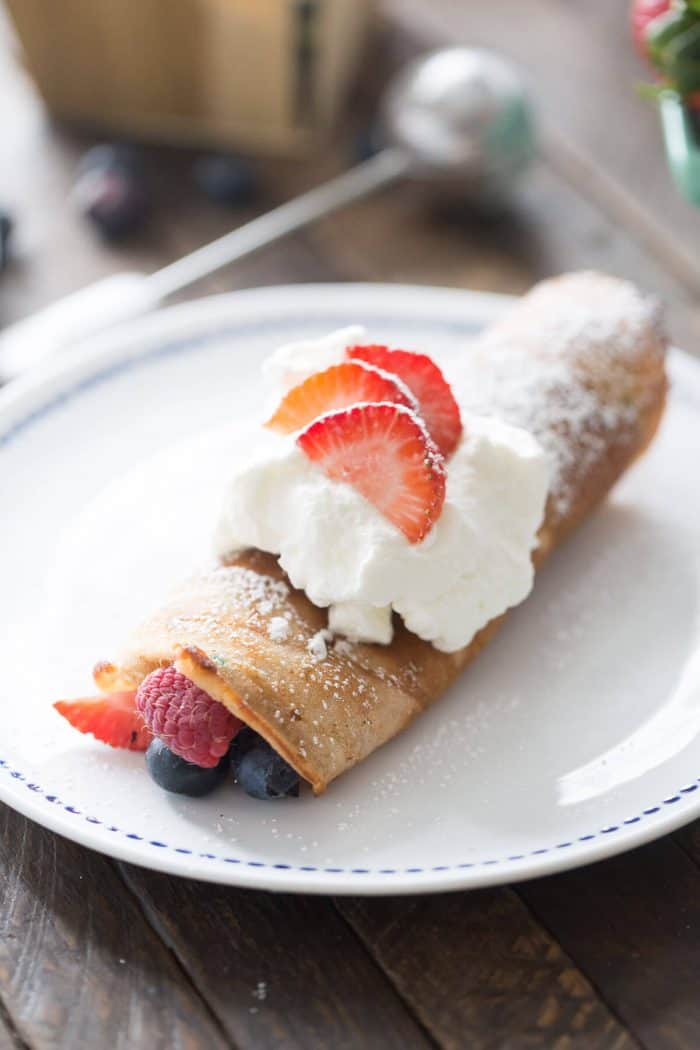 Red, White and Blue Dessert Crepes for all your patriotic needs! This easy recipe starts with a cake mix, but ends with so much sweet flavor!
