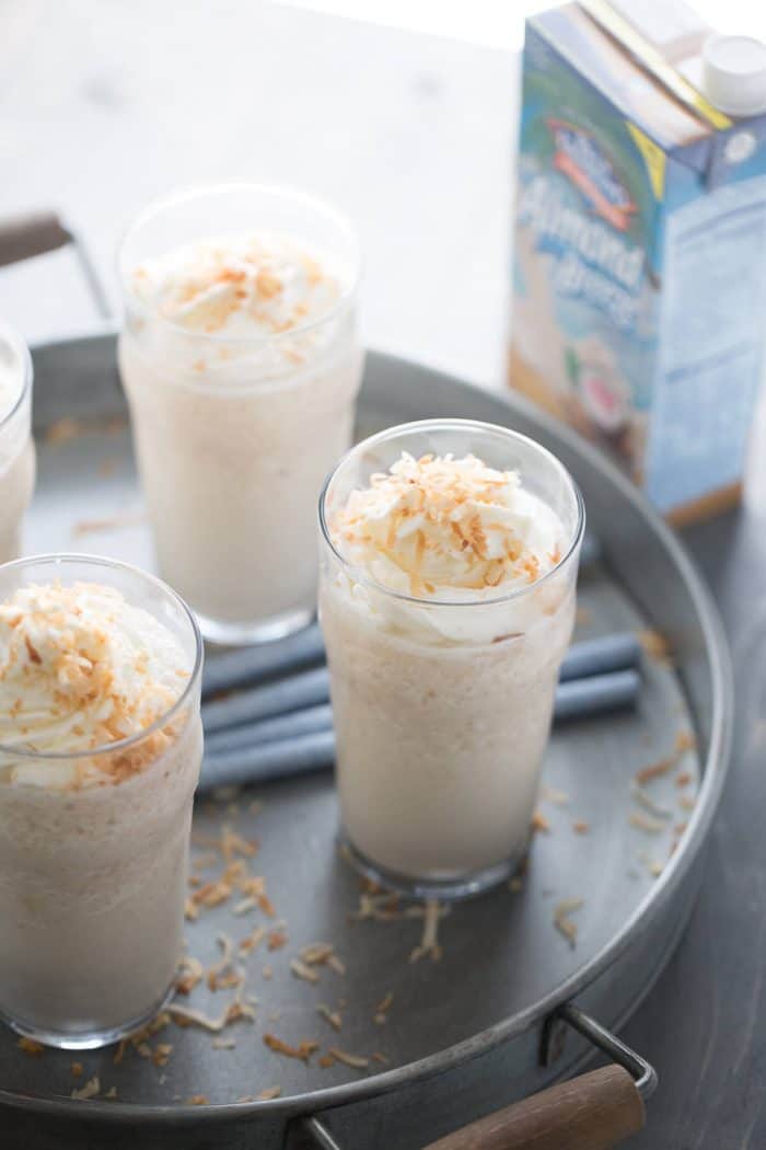 This frozen white hot chocolate combines to greats; white chocolate and toasted coconut! This cold beverage is a real sweet and creamy treat!