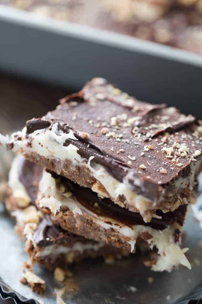 These cheesecake square are the best no bake treat you'll ever make! They have something for everyone between the coconut, the almonds, the cream cheese and the chocolate!