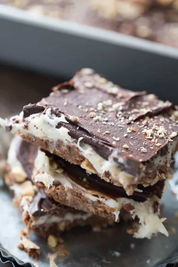 These cheesecake square are the best no bake treat you'll ever make! They have something for everyone between the coconut, the almonds, the cream cheese and the chocolate!