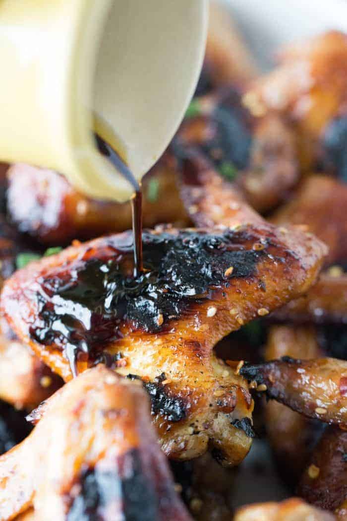 A tangy sesame ginger sauce is brushed over chicken legs and wings then grilled up golden and crisp. Grilled chicken tastes so good!