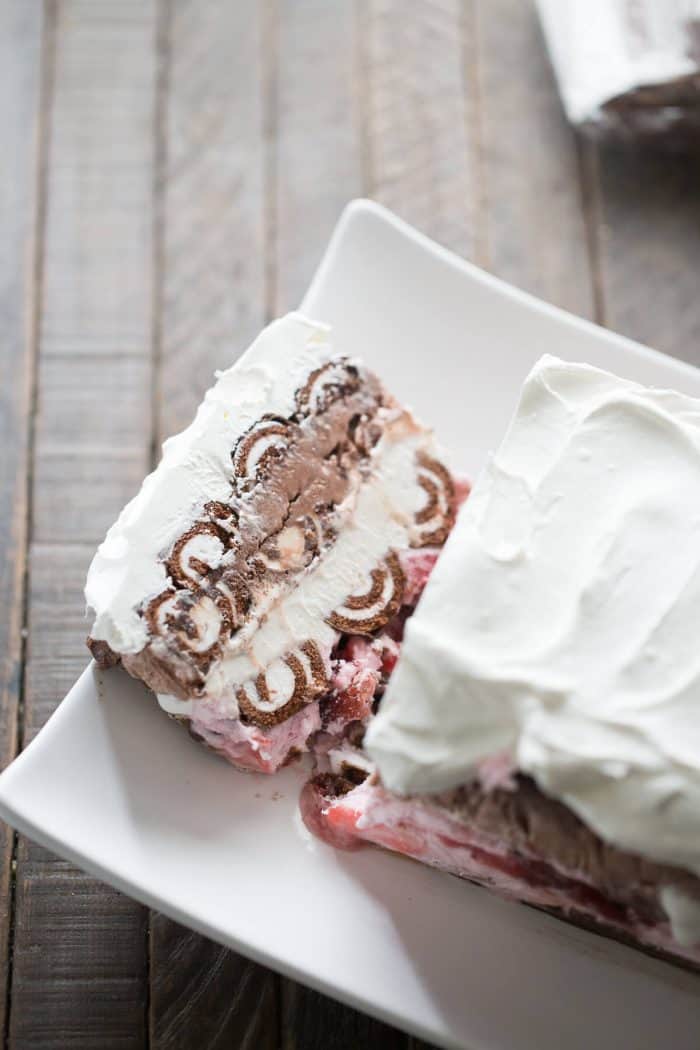 A Swiss Roll ice cream cake with so many lovely layers! Swiss Roll cakes are separated by layers of strawberry ice cream, vanilla ice cream and chocolate ice cream!
