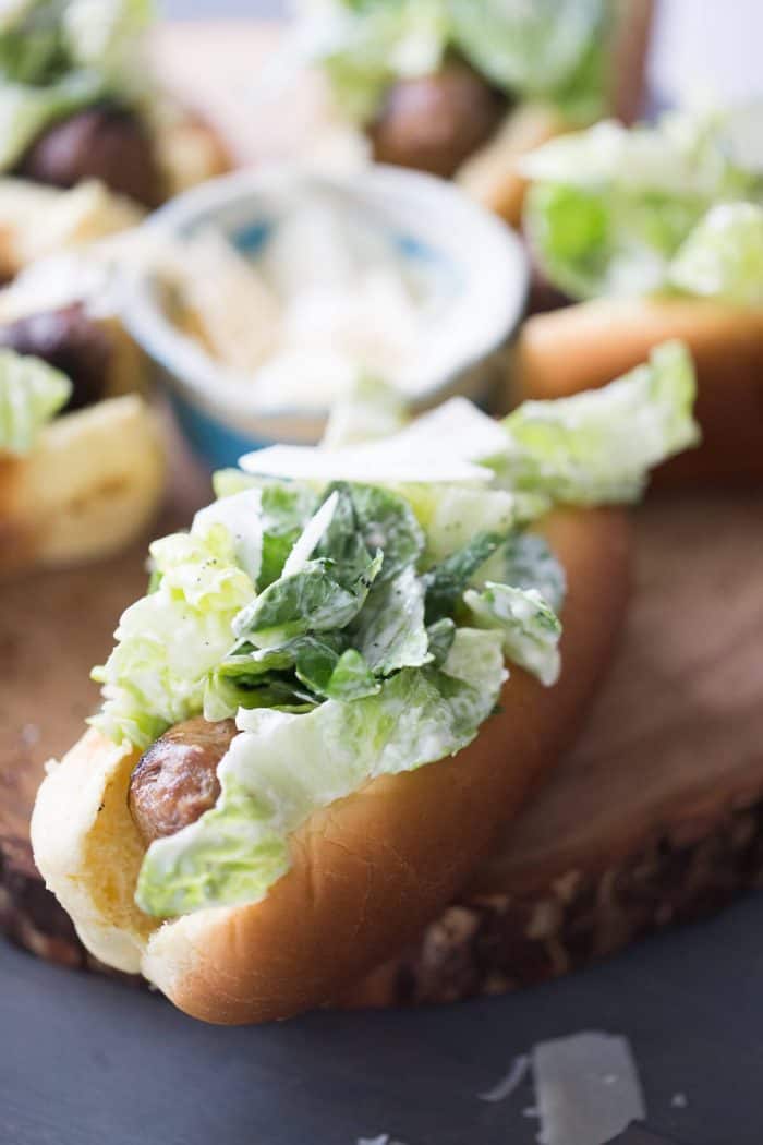 Caesar Salad is cool, crisp and creamy. This easy salad is the perfect counterpart to hot, grilled sausage!