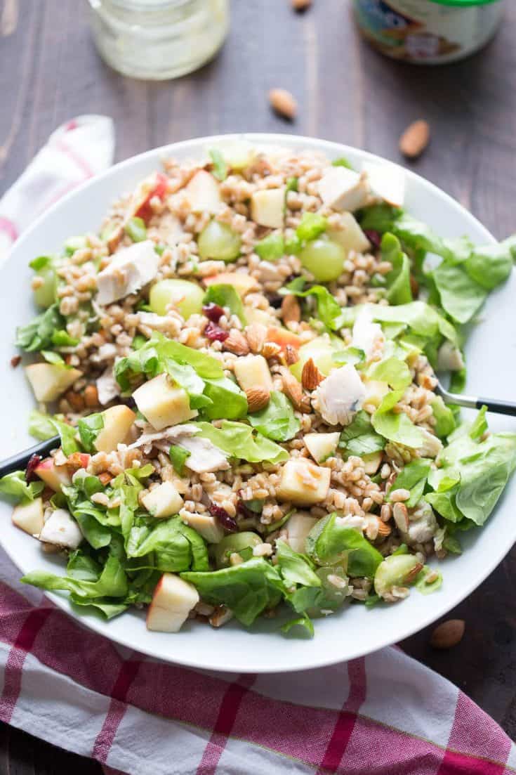 This Chicken Waldorf Salad is the ultimate in satisfaction! Farro, chicken, fruit and lettuce are tossed with a simple honey mustard vinaigrette. Waldorf salad gets a whole new look!