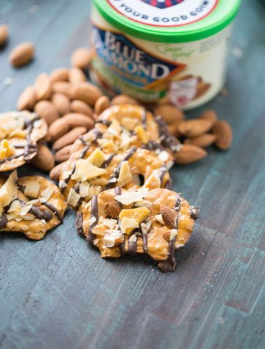 Chocolate covered pretzel start with dark chocolate that is topped with sweet, dried mangos, toasted caramel and whole almonds. This salty sweet snack will satisfy every craving!