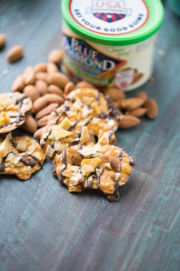 Chocolate covered pretzel start with dark chocolate that is topped with sweet, dried mangos, toasted caramel and whole almonds. This salty sweet snack will satisfy every craving!