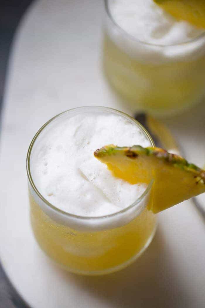 Pineapple Bourbon Punch - Nutty hazelnut flavor and pineapple are infused into bourbon to make this delicious cocktail recipe! | lemonsforlulu.com