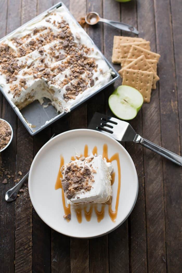 This eclair cake is like apple pie but better! Graham crackers are the "cake" layers that are held in place with apple pie filling and apple spiced pudding. Toffee bits crown the top!