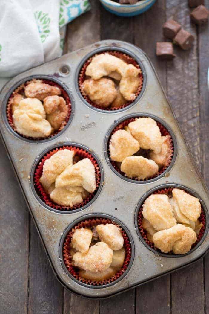 Monkey bread muffins are made with biscuits and stuffed with a sweet, apple filling!