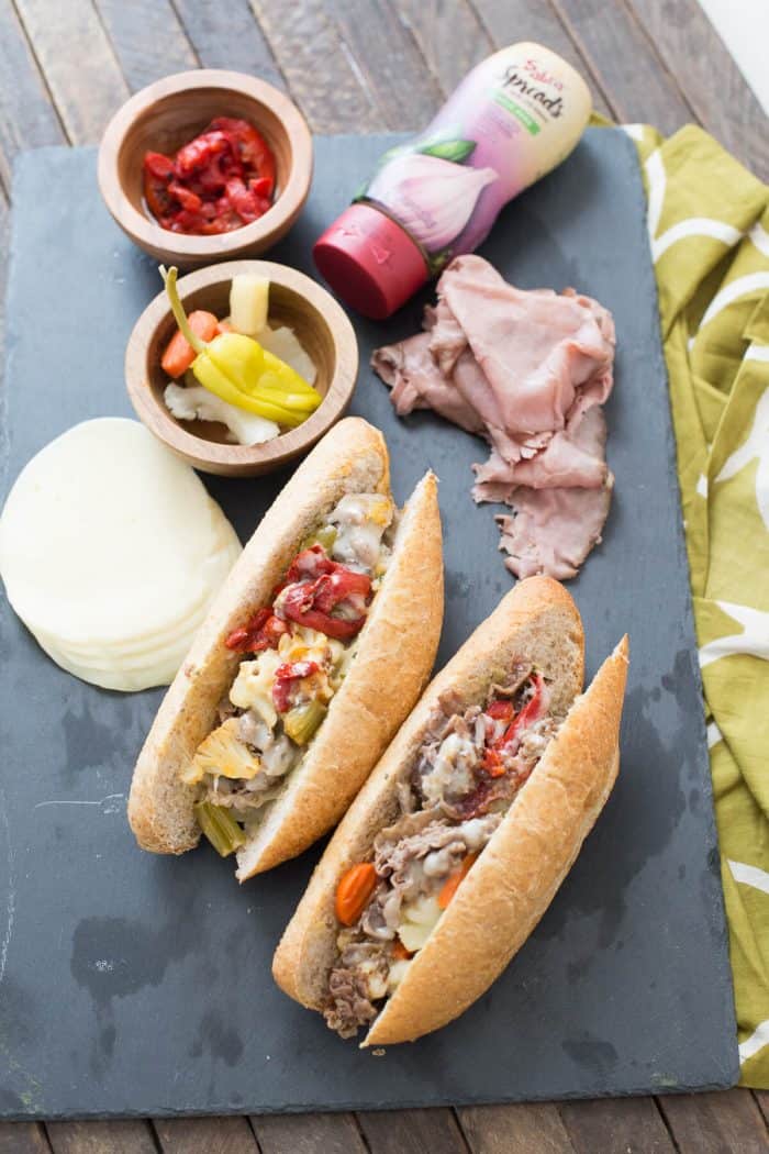 Nothing beats a good cheesesteak sandwich! This Italian version has pickled vegetables, roasted red peppers, provolone and a hummus garlic herb spread!