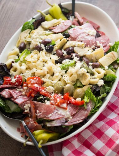 This Italian chopped salad is bursting at the seams! It is loaded with meats, cheese, veggies and pasta and boasts a creamy Italian dressing!