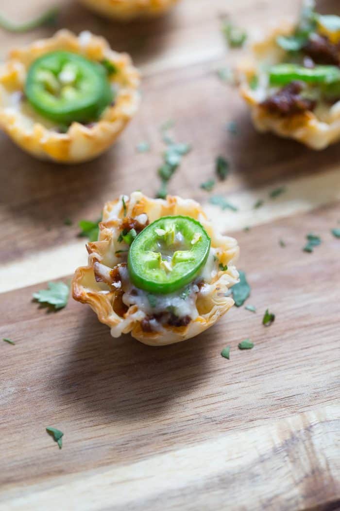 Simple queso funded bites will make your party! These cheesy two-bite snacks are made with a handful of ingredients and come together quickly!
