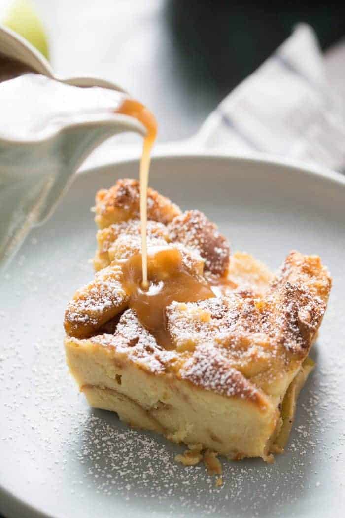 Tender sweet bread and cinnamon apples makes this bread pudding recipe taste amazing! The caramel sauce on top is the crowning glory!