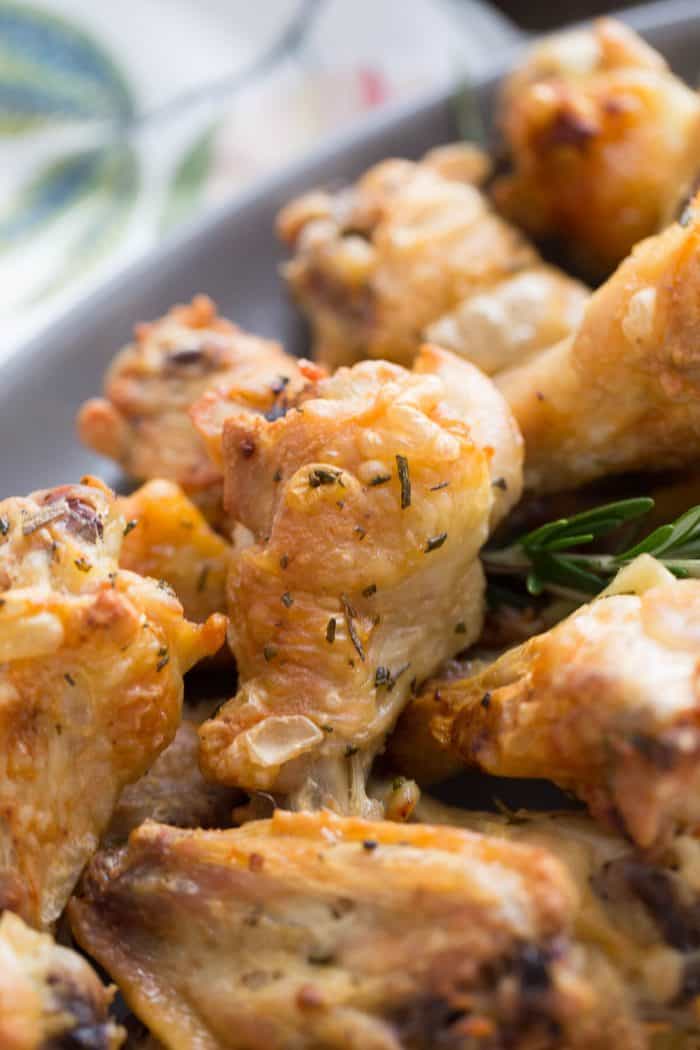 These crispy baked chicken wings are coated in butter, rosemary and garlic. Don't forget the mustard sauce!