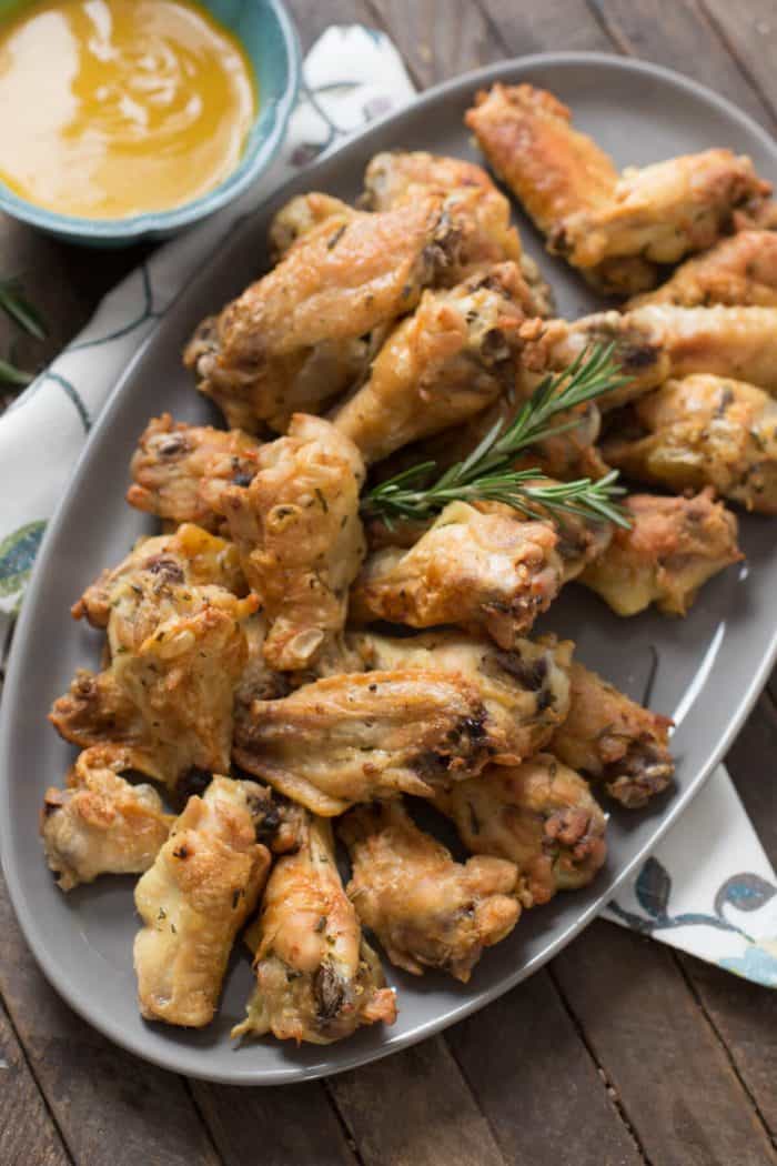 These crispy baked chicken wings only require a handful of ingredients and they taste amazing! Be sure to serve up the mustard sauce!