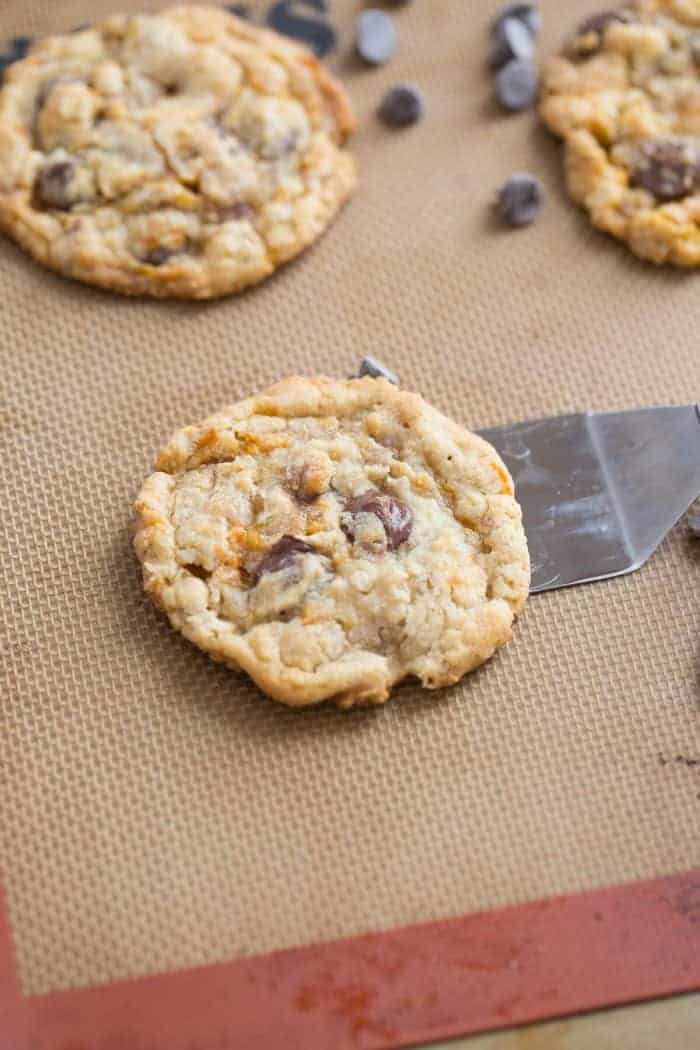 Three Butterfinger cookies surrounded by chocolate chips.