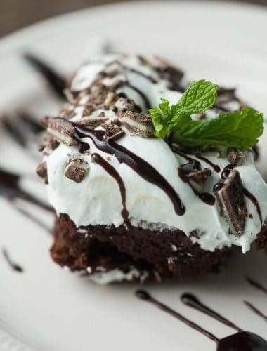 Ultra rich chocolate cake is topped with a creamy mint frosting in this easy to make mint chocolate cake