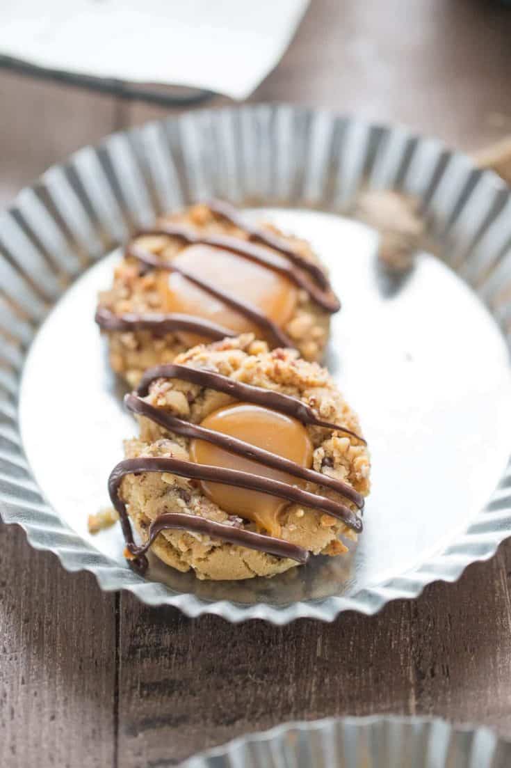 These thumbprints take on peanut butter,, caramel chocolate and nuts to create a unique twist on turtle cookies!