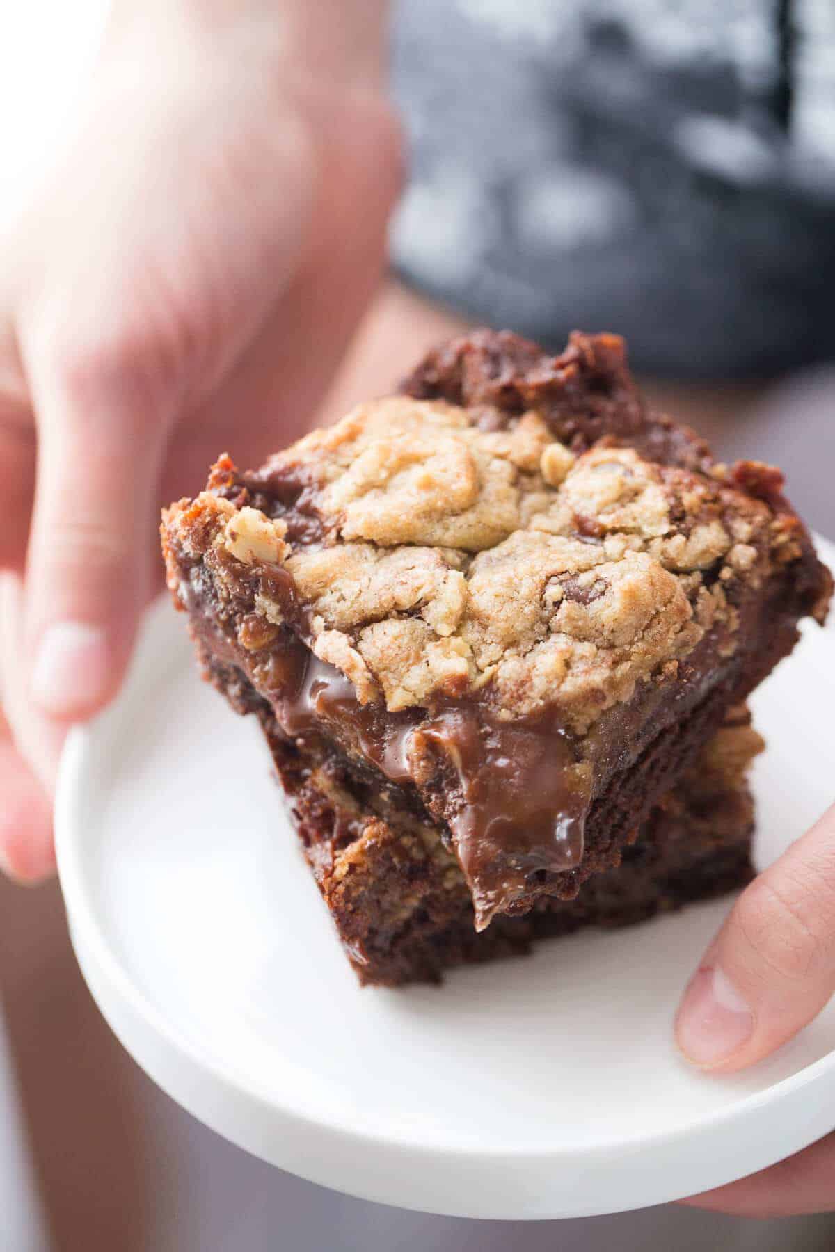 These Brookie bars have chocolate brownie base, a chocolate chip cookie top and a smooth chocolate caramel layer in the center!
