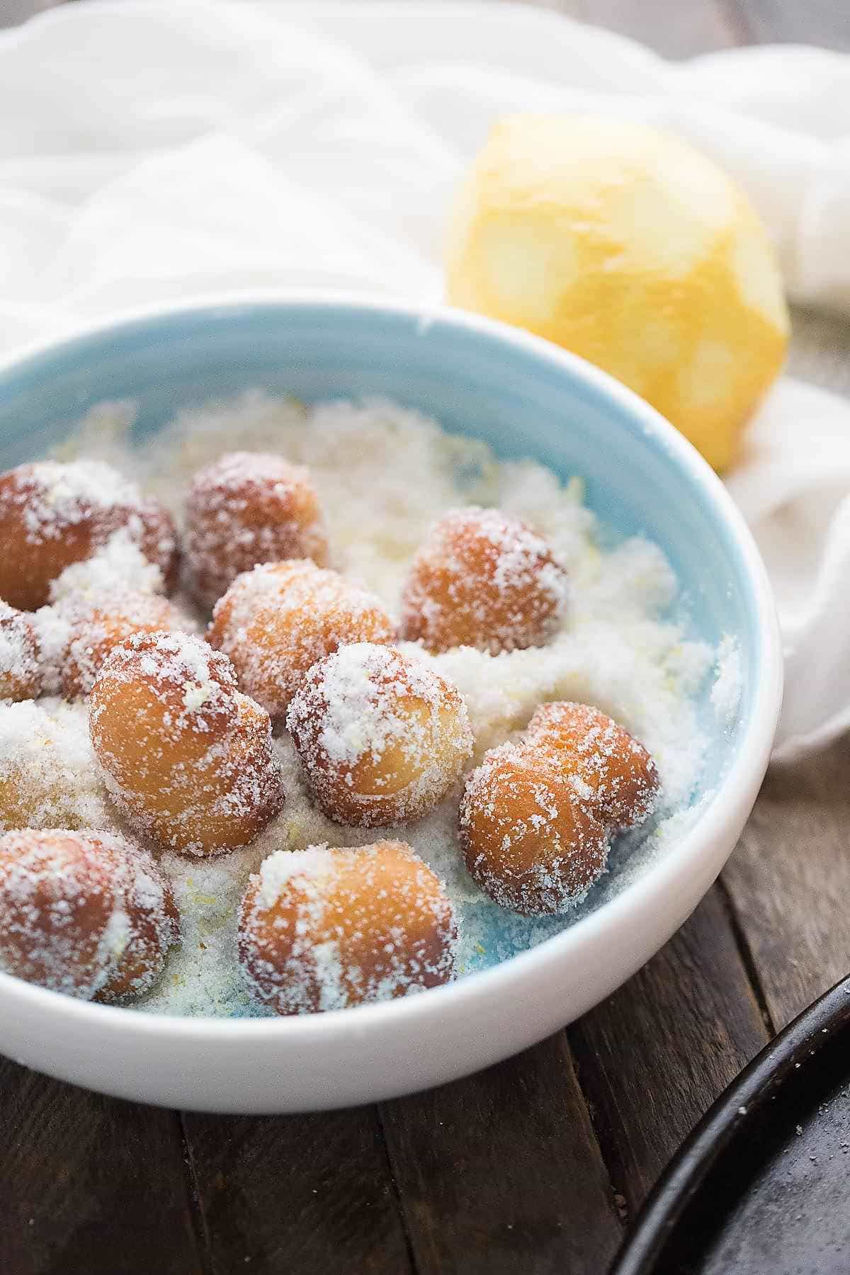 Sweet little fried biscuit donuts coated in a lemon sugar mixture!