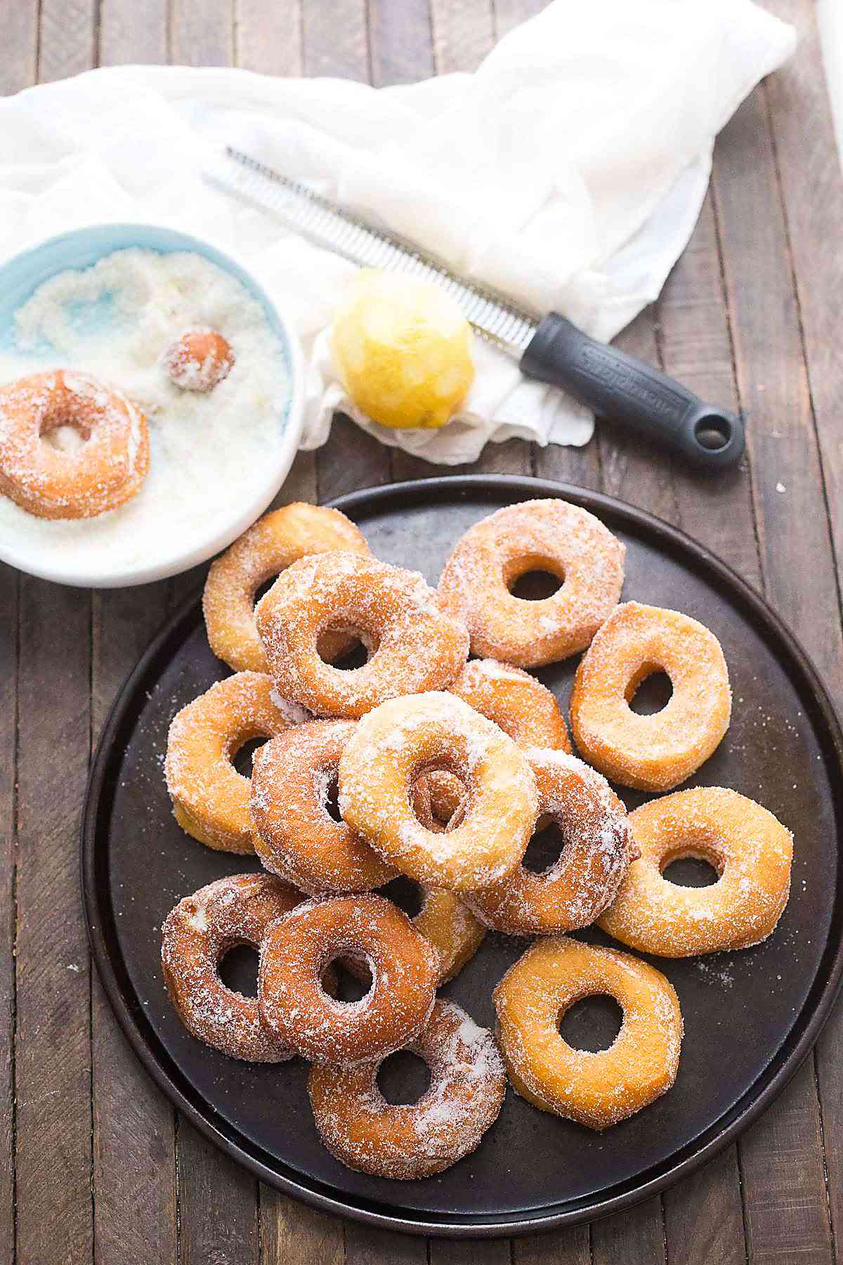 Biscuit donuts are lightly fried then coated in a simple lemon sugar mixture!