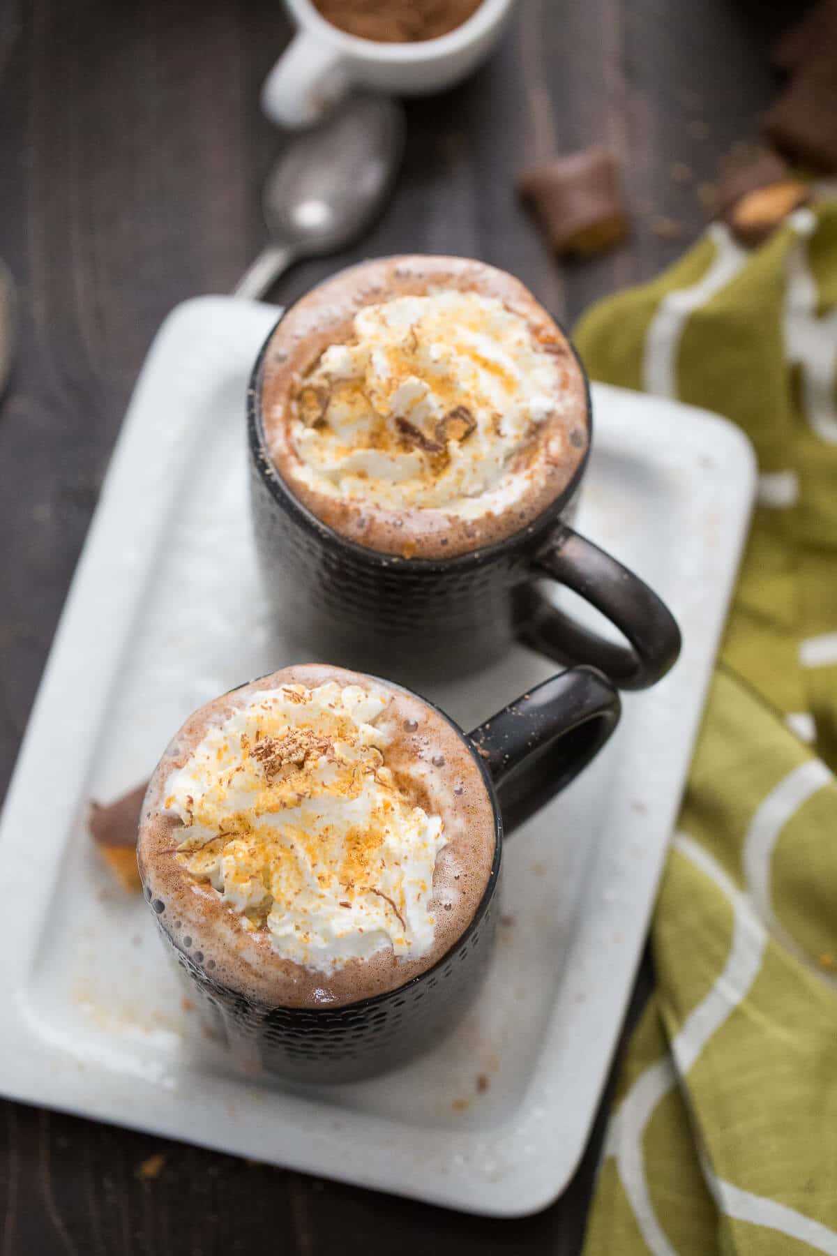 This Butterfinger Hot Cocoa recipe tastes like the famous candy! This boozy version is warm and silky warm adult beverage!