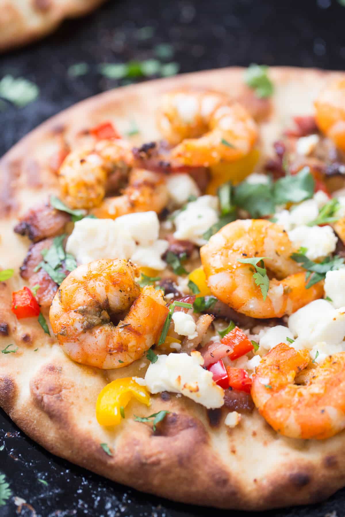 This Cajun shrimp pizza features spiced up shrimp baked on naan bread! Dinner couldn't be simpler!