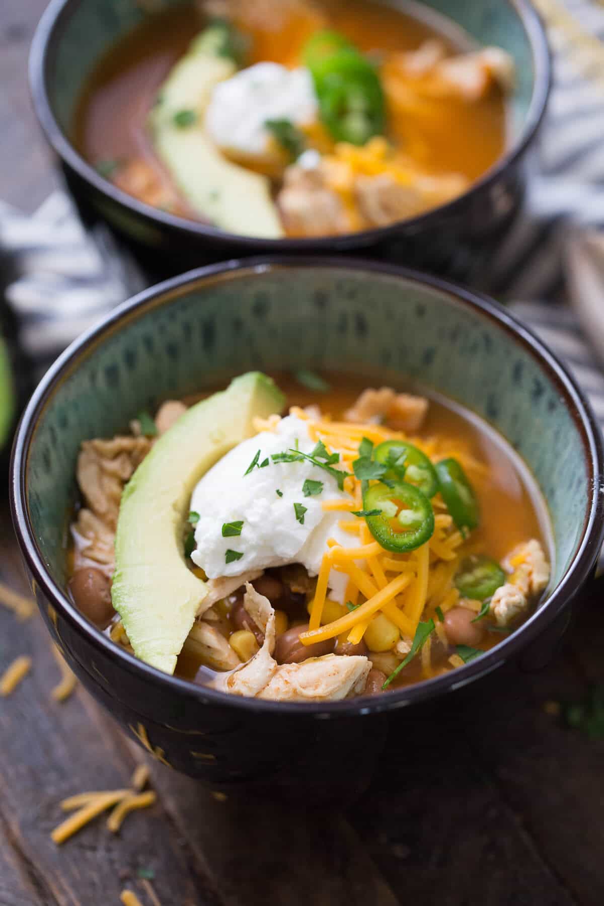 This slow cooker chicken chili is everything you want in a chili.  It is hearty and satisfying!