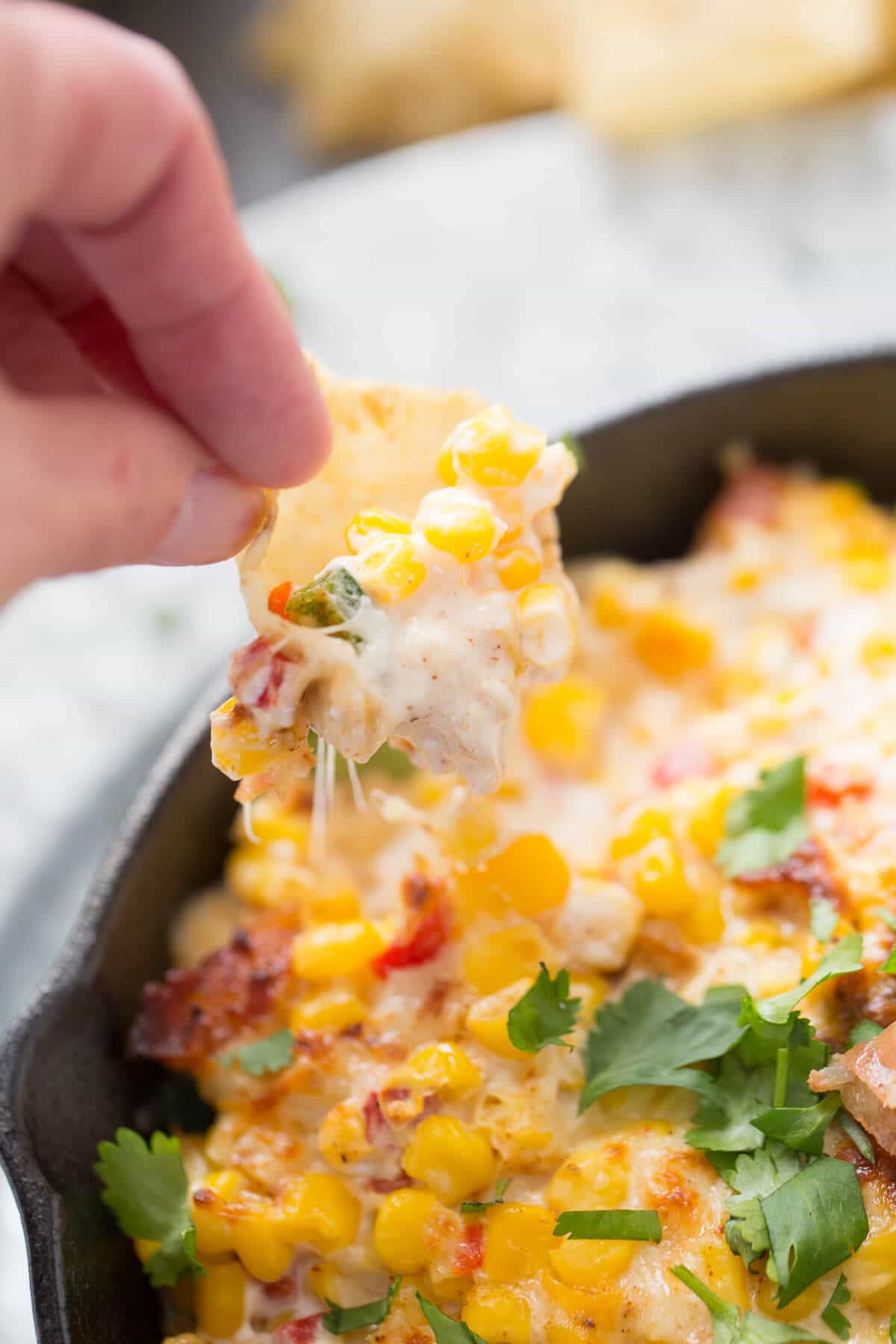 Hot corn dip is amazing! Corn, cheese, and bacon come together for the best dip ever!
